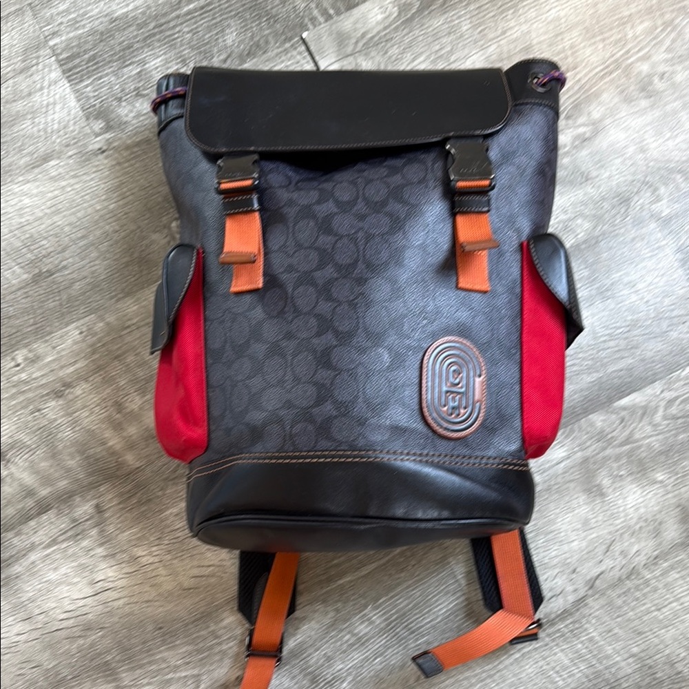 Coach Black and Red Leather Backpack with Flap-Over Design